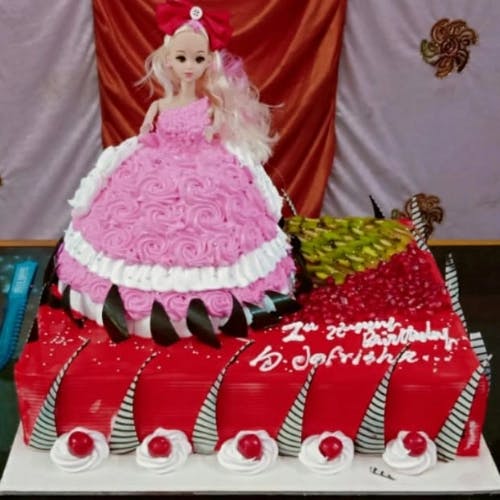 Barbie Red Velvet Cake with Fruit Garnishing Indulge in the luxurious and sophisticated taste of our Barbie Red Velvet Cake, adorned with a luscious fruit garnishing that will awaken your senses and tantalize your taste buds.