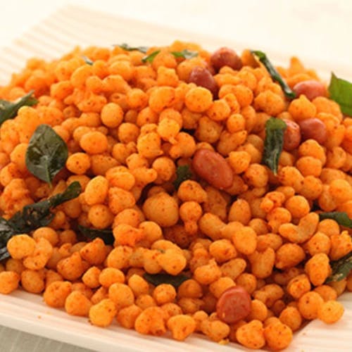 Kara Boondi Indulge in the delight of Kara Boondi, a beloved Indian snack known for its crispy texture and burst of flavors.