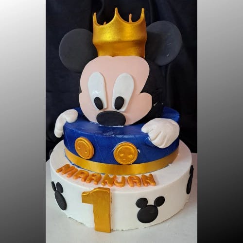 Micky Mouse Fondant Cake Relive the joy and wonder of childhood with our Micky Mouse Fondant Cake, a masterpiece of sweetness and nostalgia that is sure to bring back cherished memories and create new ones.