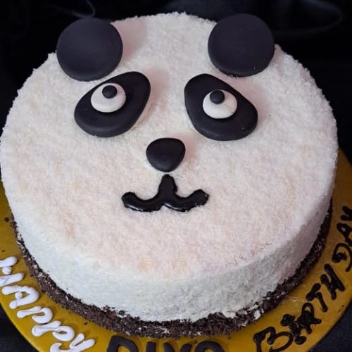 Panda Fondant Cake Add some fun to your next celebration with a Panda Fondant Cake. This adorable cake features a cute panda design, expertly crafted from smooth and delicious fondant. With its cute and playful design, a Panda Fondant Cake is the perfect addition to any party, whether it's a child's birthday or a fun-filled get-together with friends. And not only does it look great, but it also tastes amazing, with its moist and fluffy cake layers and delectable buttercream frosting. Made with only the finest ingredients and baked to perfection, this cake is a true delight for both the eyes and the taste buds. So make your next party extra special with a Panda Fondant Cake that's sure to leave a lasting impression on all your guests.