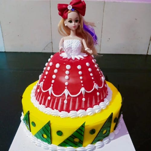 Pineapple Barbie Cake Looking for a fun and fresh cake idea for your child's birthday party? Consider making a Pineapple Barbie Cake! This cake features a pineapple-flavored sponge cake, layered with luscious buttercream frosting, and decorated with colorful tropical flowers and a Barbie doll in the center. The cake is not only visually stunning, but also deliciously moist and flavorful. Your little one and their guests will love the tropical vibe and the fun surprise of the Barbie doll in the center. With this recipe, you can create your own Pineapple Barbie Cake at home and add a touch of sunshine to any special occasion.